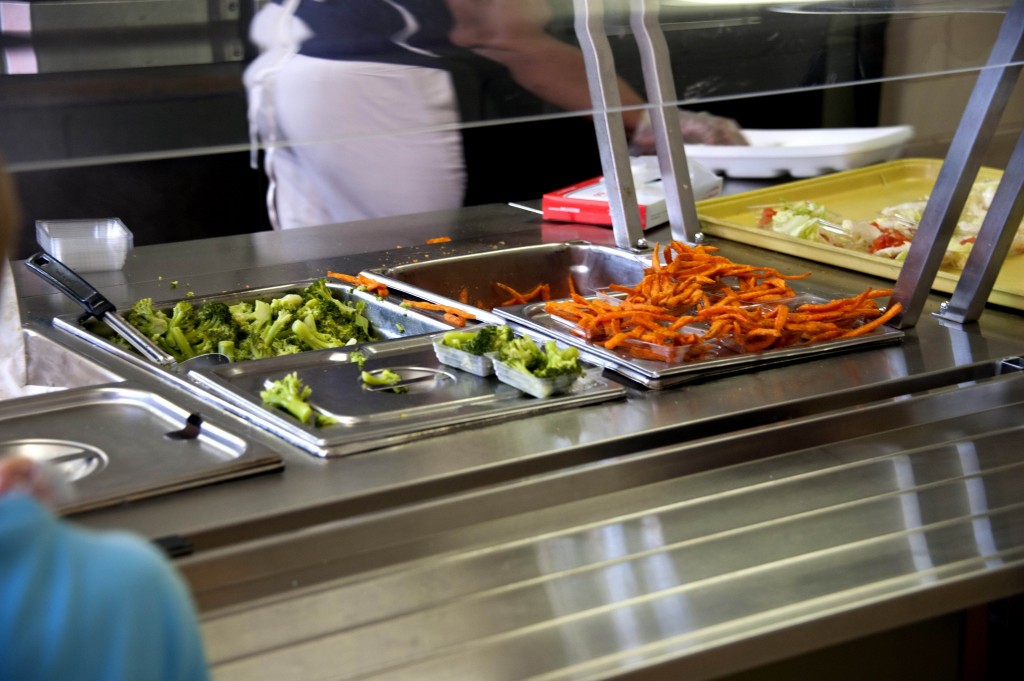 Focusing on the lunch line operated by cafeteria custodians