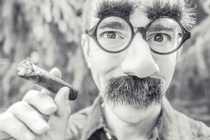photo of person wearing funny glasses with bushy eyebrows and mustache