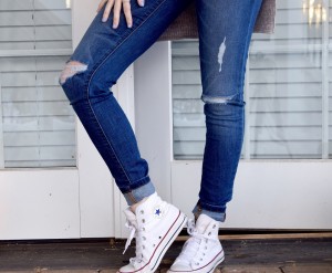 image of girl in skinny jeans with holes in them