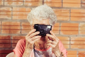 old woman with camera